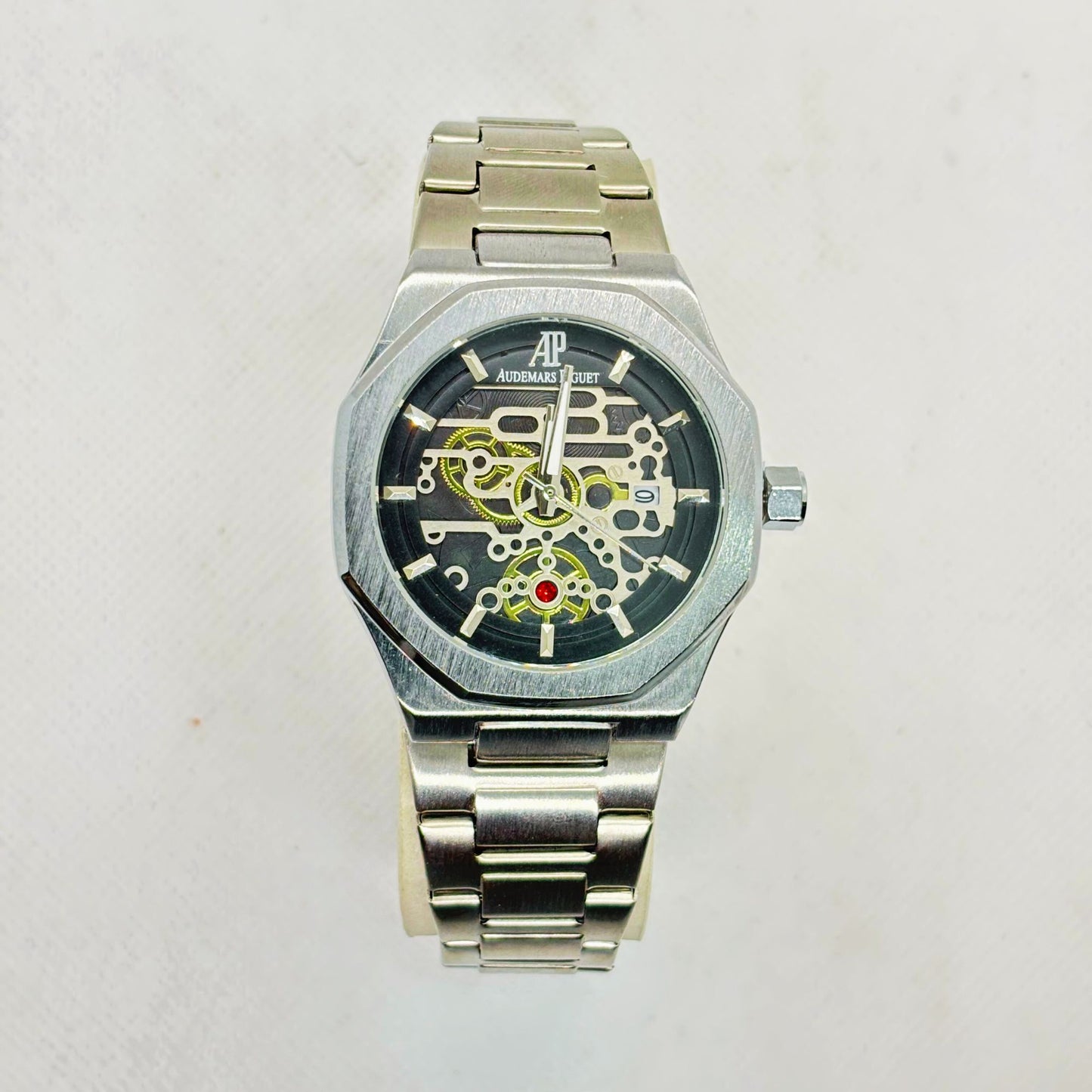 Front view of silver men's quartz watch with skeleton-style dial and stainless steel strap – luxury-inspired design

