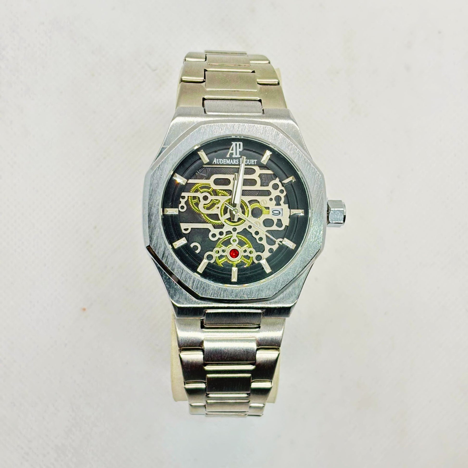 Front view of silver men's quartz watch with skeleton-style dial and stainless steel strap – luxury-inspired design

