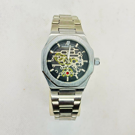 Front view of silver men's quartz watch with skeleton-style dial and stainless steel strap – luxury-inspired design

